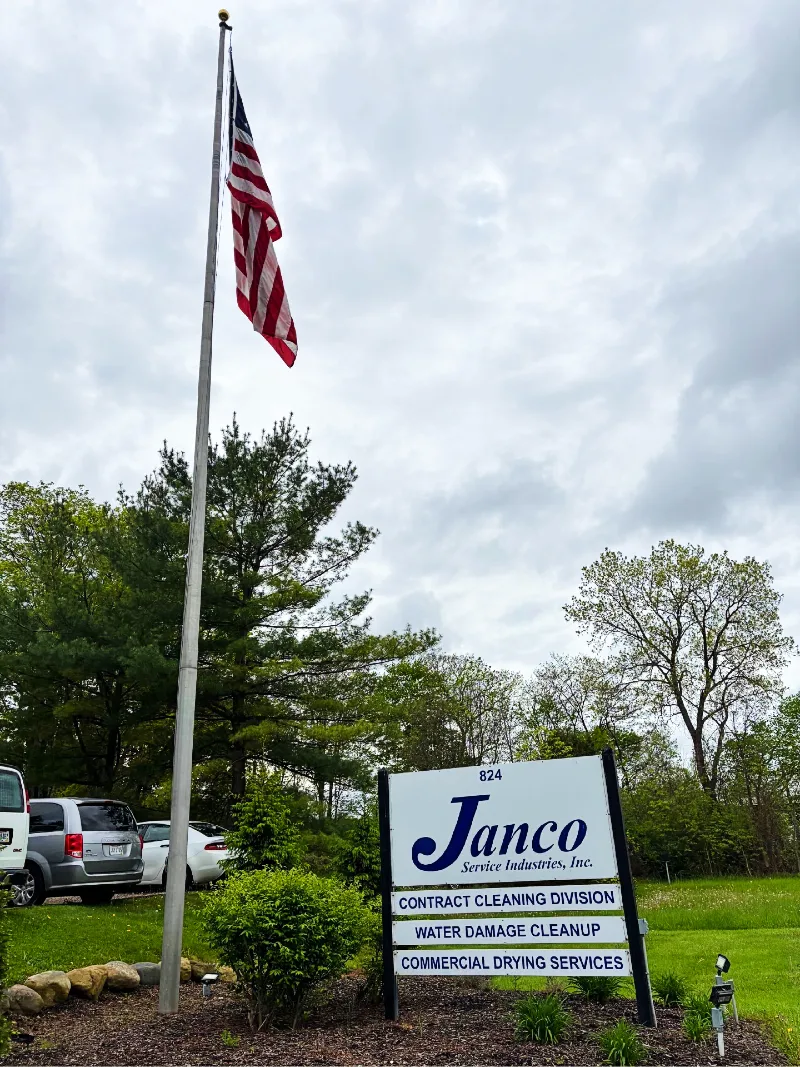 Janco sign under an American flag